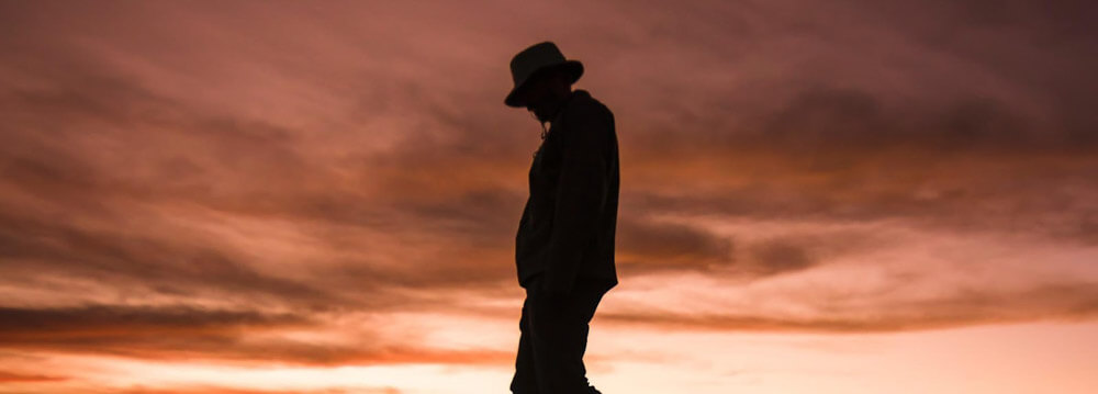 Shadow image of man against a sunset