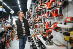 man browsing power tools in a retail store